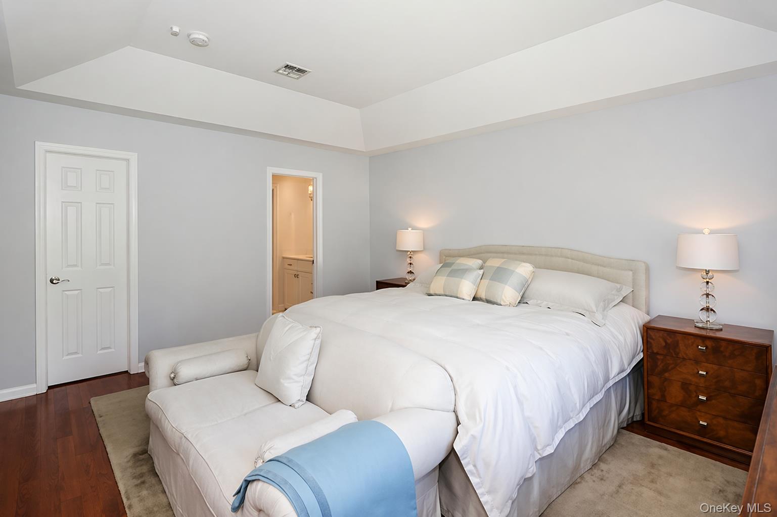 4 Spring Court Huntington, NY 11743 - Photo 15 of 38 a bedroom with a bed and a lamp