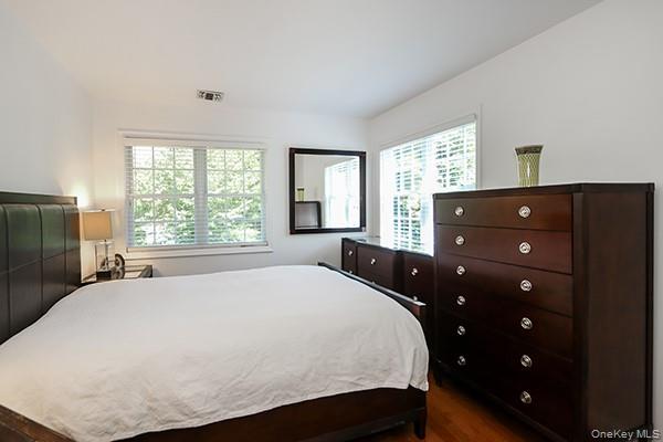 4 Spring Court Huntington, NY 11743 - Photo 19 of 38 a bedroom with a bed and a window