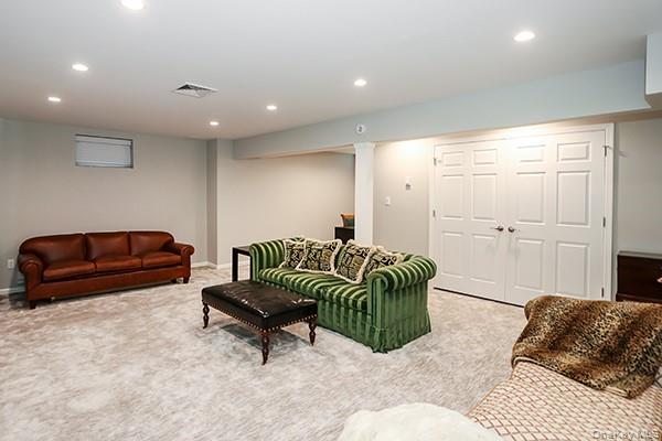 4 Spring Court Huntington, NY 11743 - Photo 23 of 38 a living room with furniture and a rug