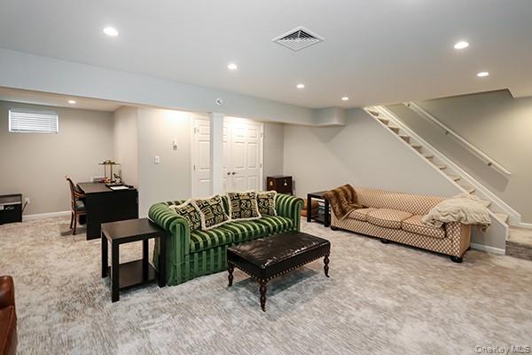 4 Spring Court Huntington, NY 11743 - Photo 24 of 38 a living room with furniture and a couch
