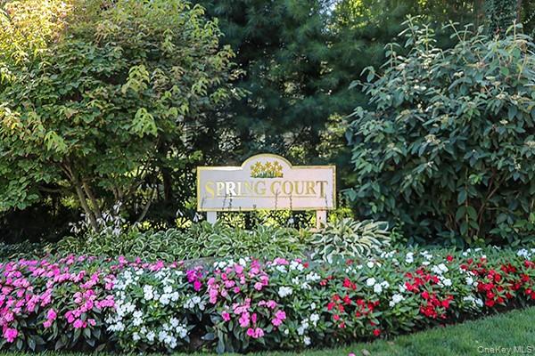 4 Spring Court Huntington, NY 11743 - Photo 32 of 38 a sign that is in front of flowers