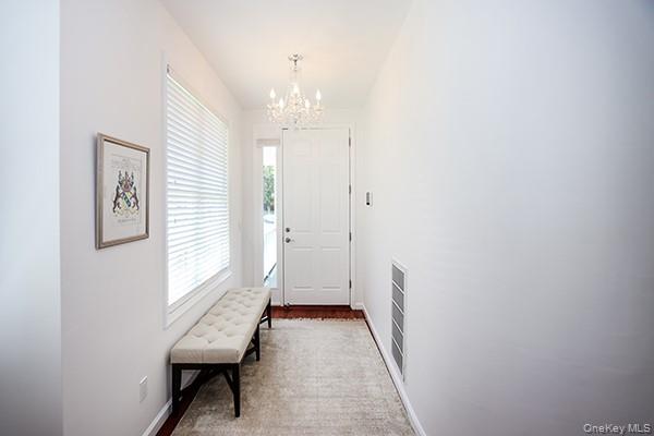 4 Spring Court Huntington, NY 11743 - Photo 4 of 38 a view of a room with wooden floor and a window