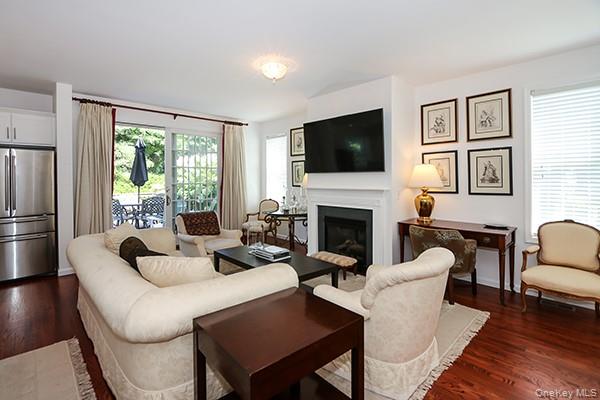 4 Spring Court Huntington, NY 11743 - Photo 6 of 38 a living room with fireplace furniture and a flat screen tv
