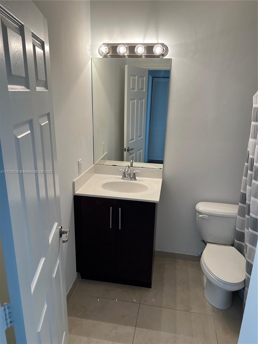 Doral Doral, FL 33178 - Photo 17 of 32 a bathroom with a sink and a toilet