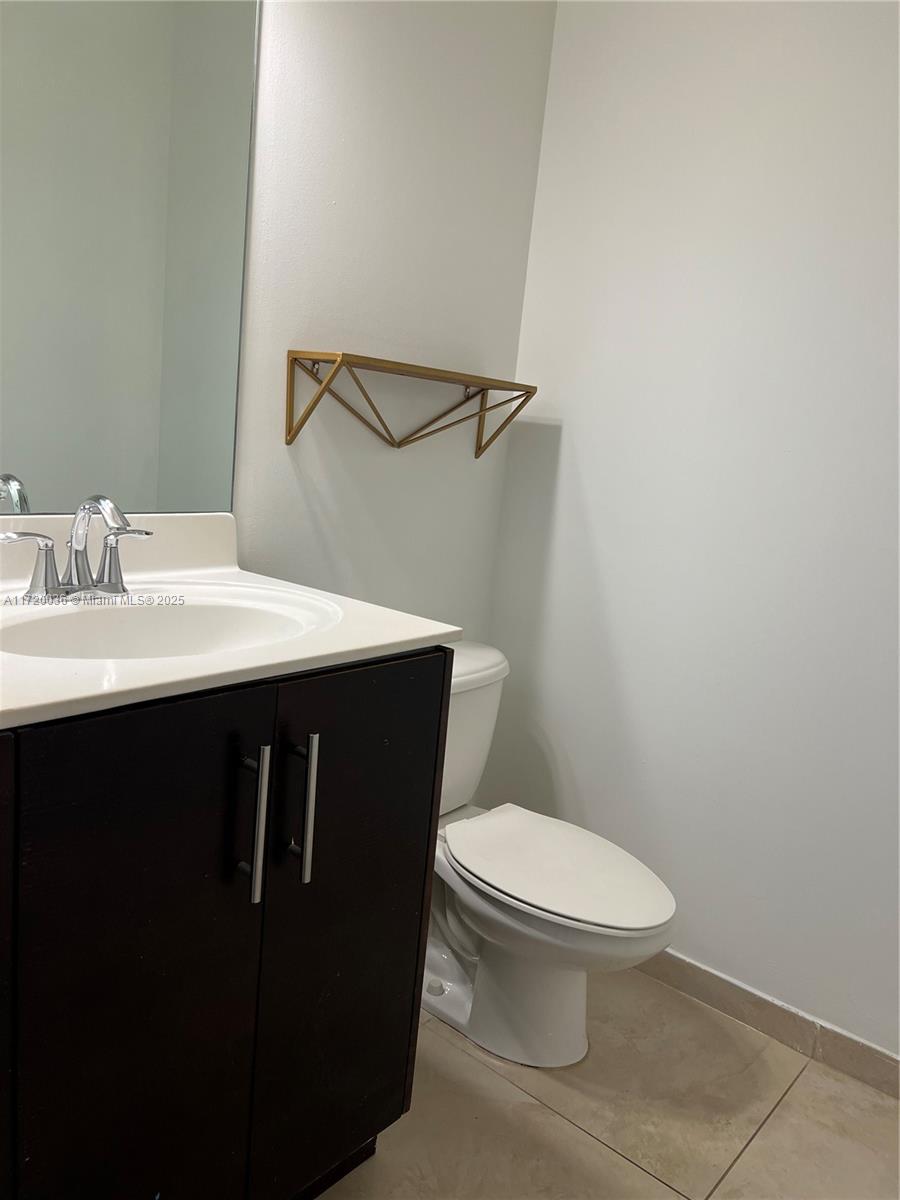 Doral Doral, FL 33178 - Photo 18 of 32 a bathroom with a sink a toilet and a mirror