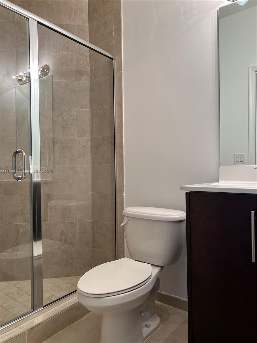 Doral Doral, FL 33178 - Photo 20 of 32 a white toilet sitting next to a bathroom sink