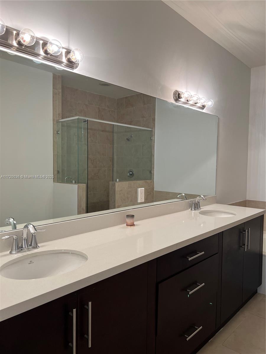 Doral Doral, FL 33178 - Photo 21 of 32 a bathroom with a sink double vanity and a mirror
