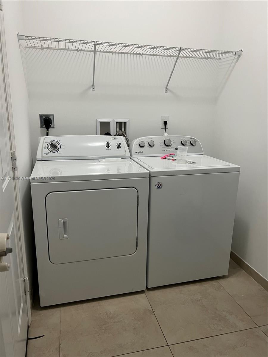 Doral Doral, FL 33178 - Photo 24 of 32 a utility room with dryer and washer