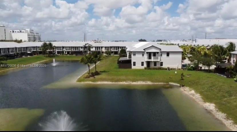Doral Doral, FL 33178 - Photo 30 of 32 a view of a lake with a house in the background