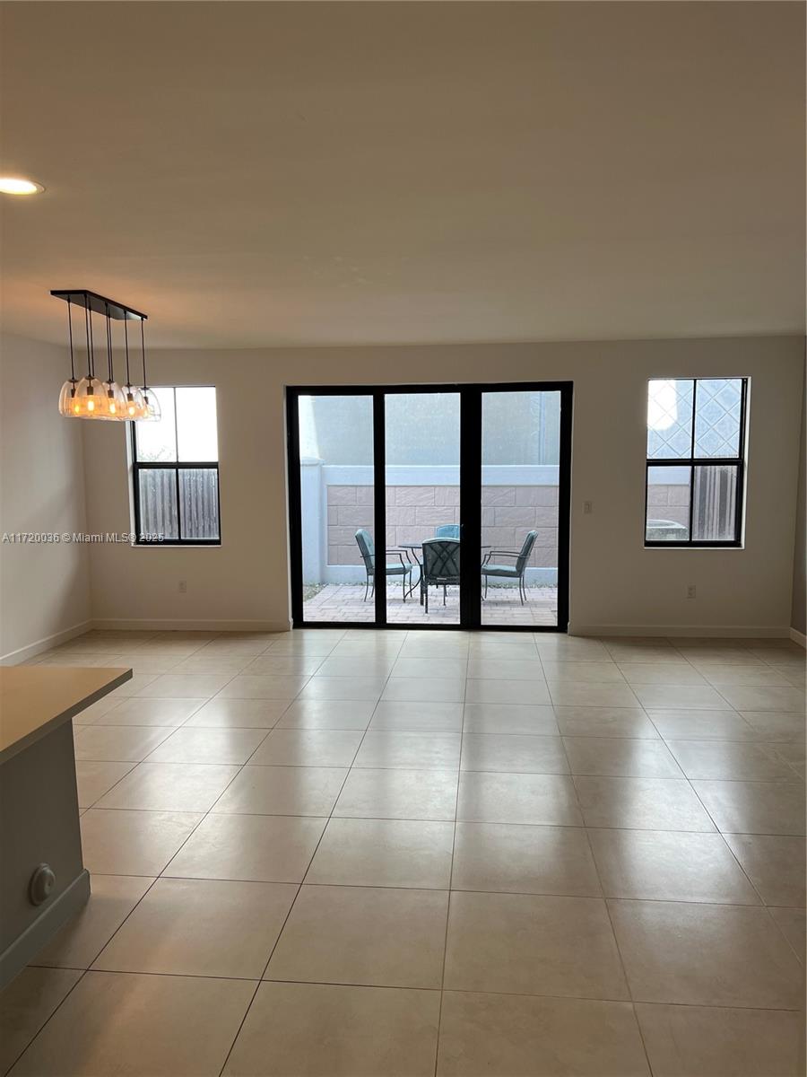 Doral Doral, FL 33178 - Photo 3 of 32 a view of an empty room with windows and cabinet