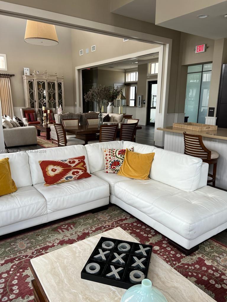 Doral Doral, FL 33178 - Photo 32 of 32 a living room with furniture and a large mirror