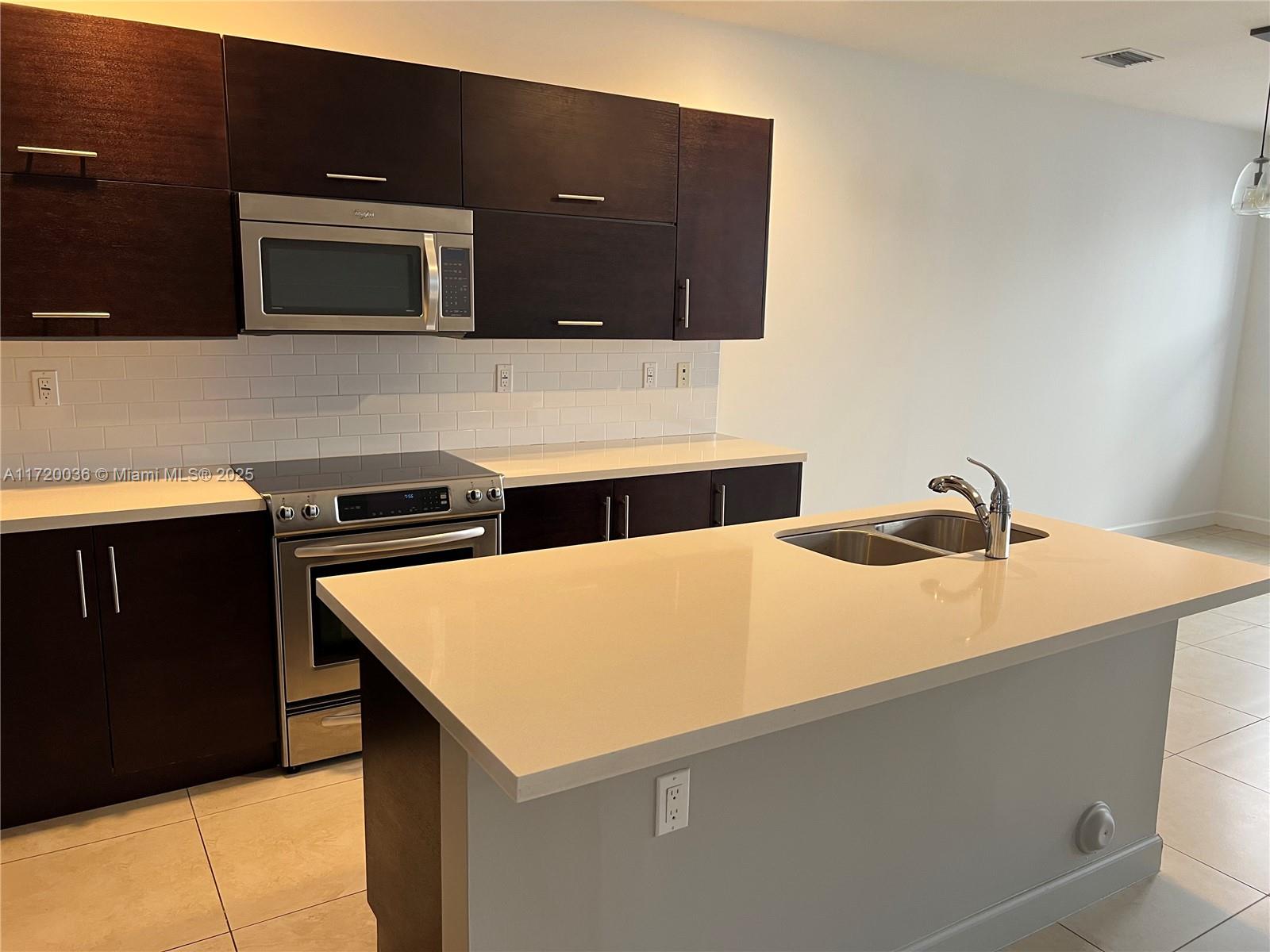 Doral Doral, FL 33178 - Photo 6 of 32 a utility room with washer and dryer