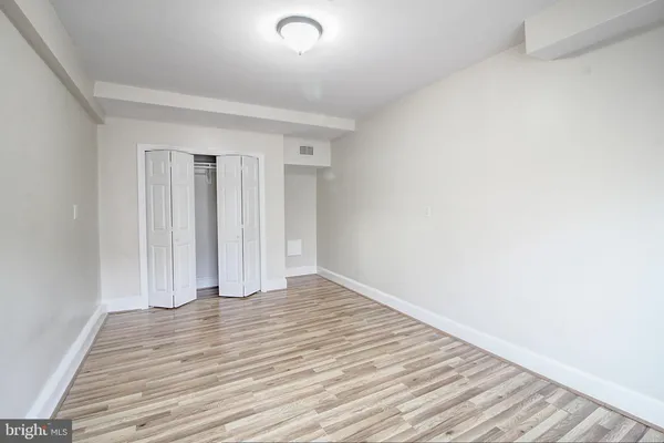 a view of wooden floor and brick walls