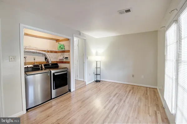 a kitchen with granite countertop a stove and a refrigerator