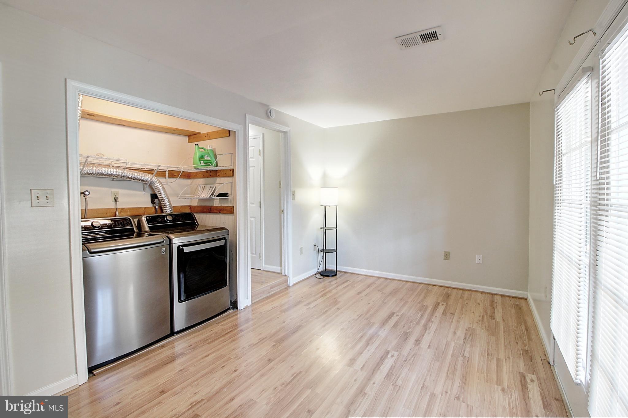 42 Victoria Square Frederick, MD 21702 - Photo 19 of 21 a kitchen with granite countertop a stove and a refrigerator