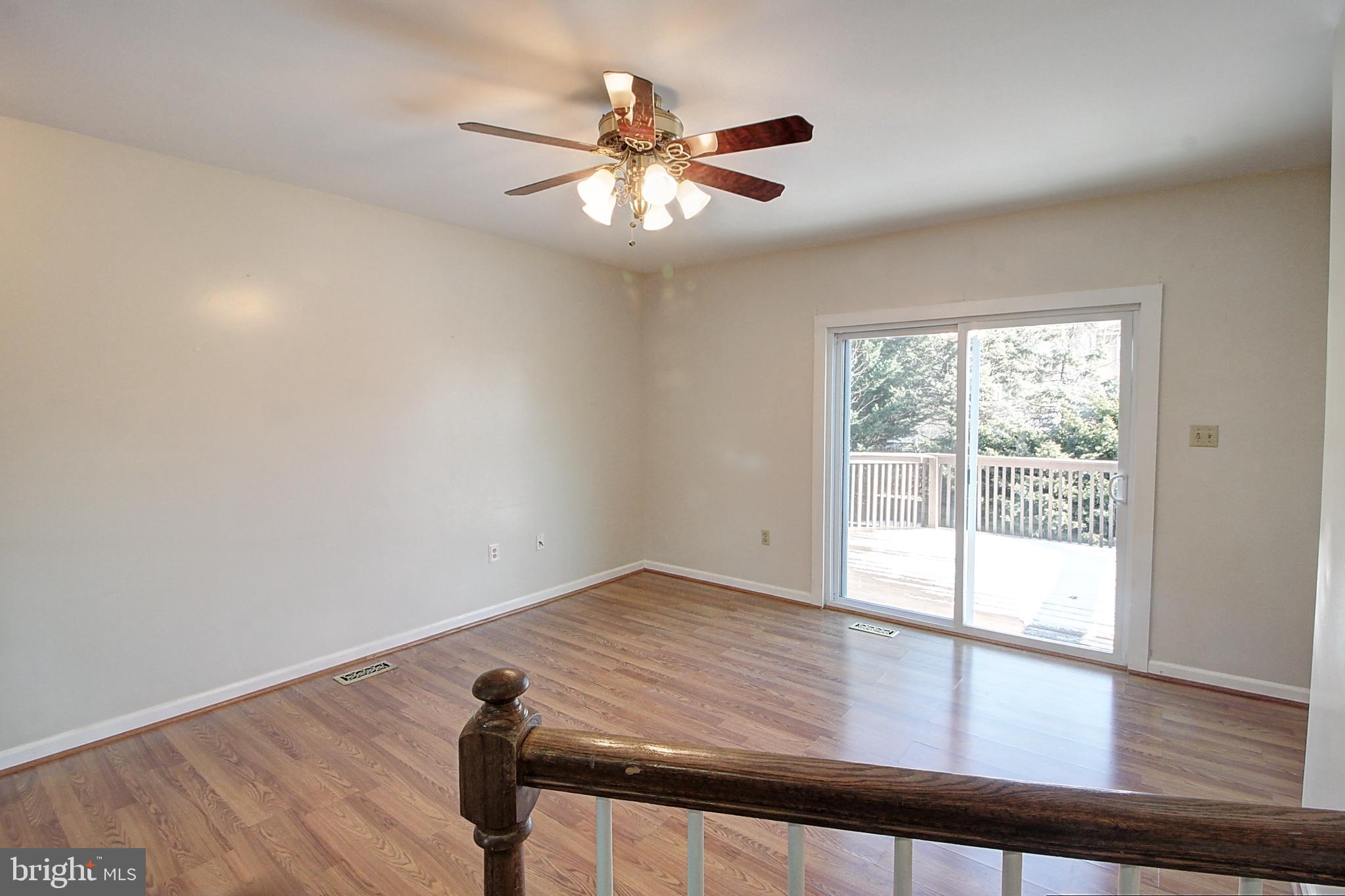 42 Victoria Square Frederick, MD 21702 - Photo 8 of 21 wooden floor in an empty room with a window