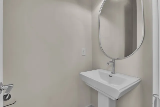 a bathroom with a sink and mirror