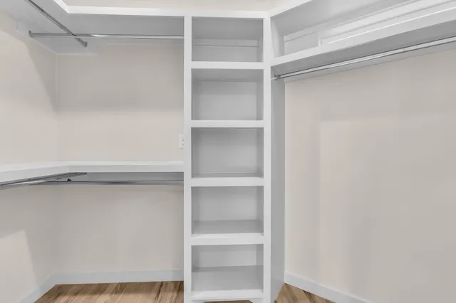a view of an empty walk in closet
