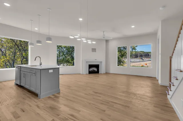 a view of living room with furniture and a fireplace