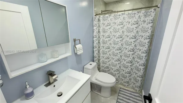 a bathroom with a sink and a toilet