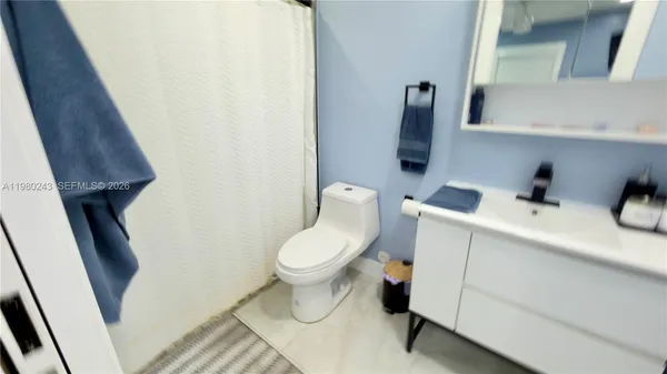 a bathroom with a toilet and a sink