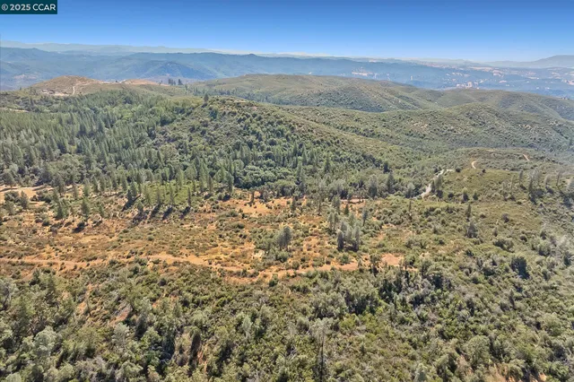 a view of a city with mountains in the background