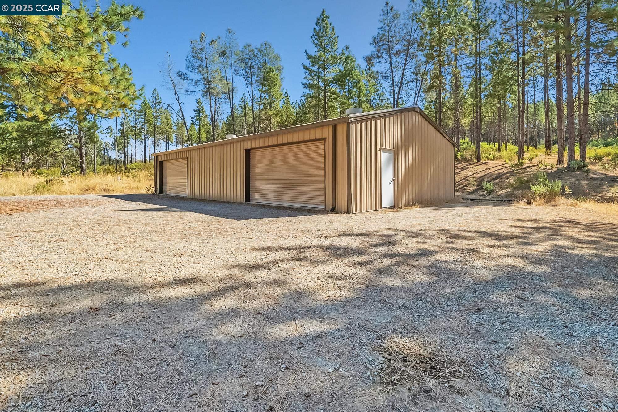 7559 Alamo Rd Mountain Ranch Mountain Ranch, CA 95246 - Photo 17 of 22 a view of a field with a snow on the road