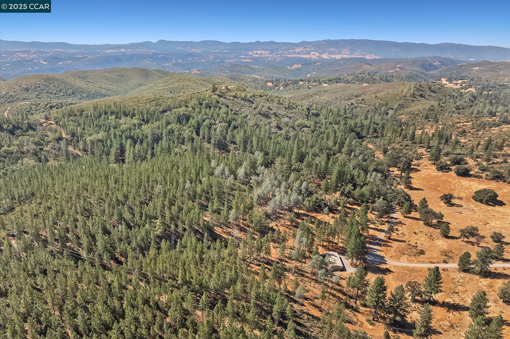 7559 Alamo Rd Mountain Ranch Mountain Ranch, CA 95246 - Photo 21 of 22 a view of a city with mountains in the background