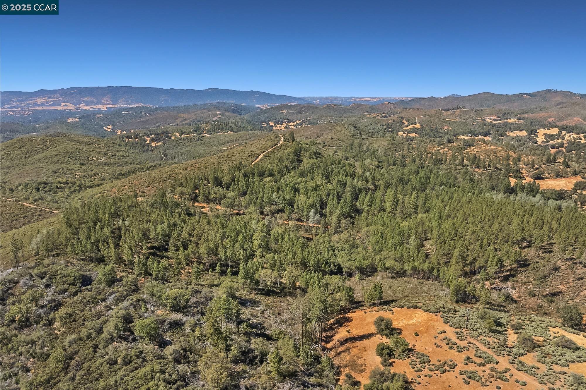 7559 Alamo Rd Mountain Ranch Mountain Ranch, CA 95246 - Photo 3 of 22 a view of a city with mountains in the background