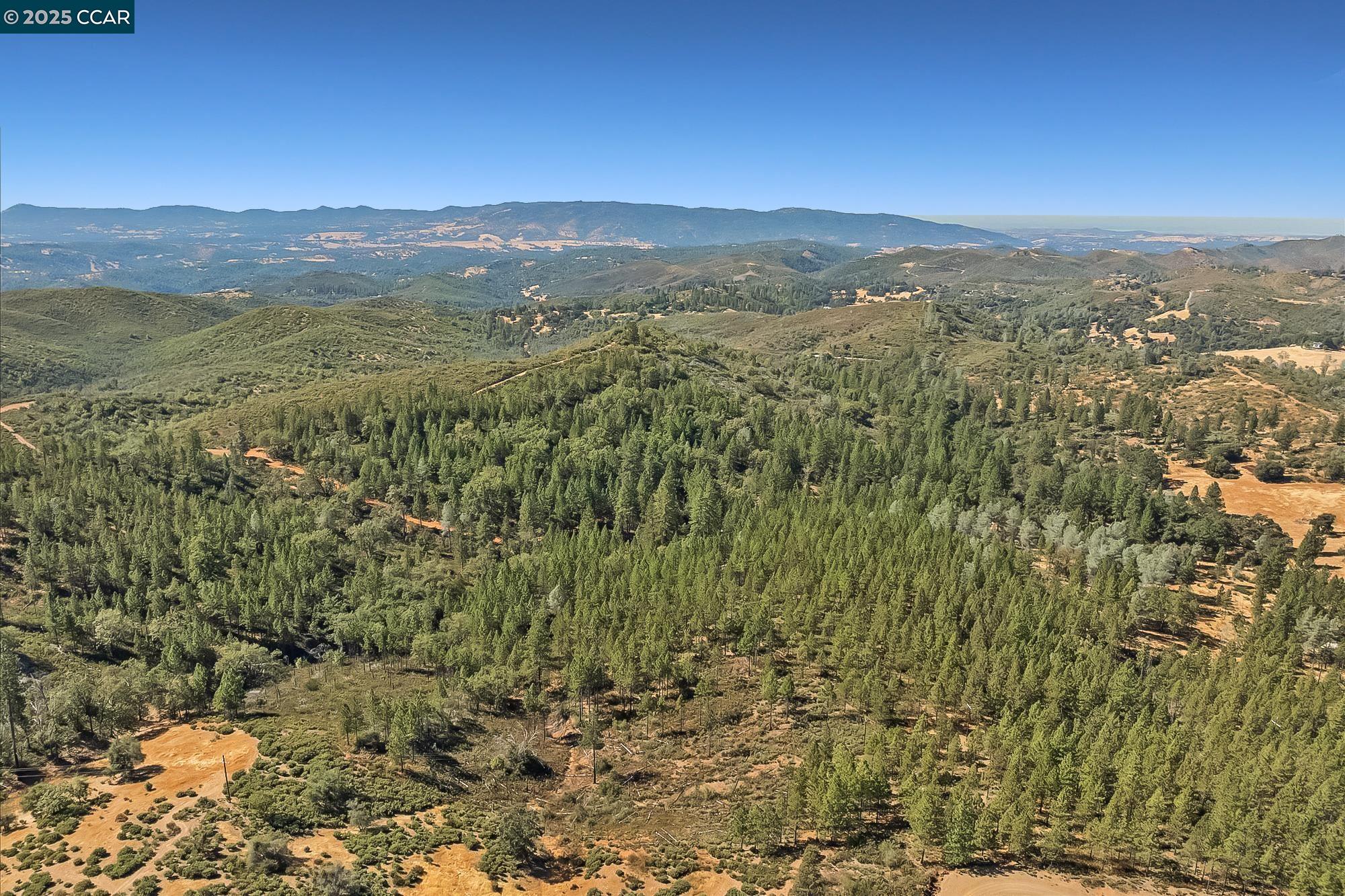 7559 Alamo Rd Mountain Ranch Mountain Ranch, CA 95246 - Photo 4 of 22 a view of a city with mountains in the background