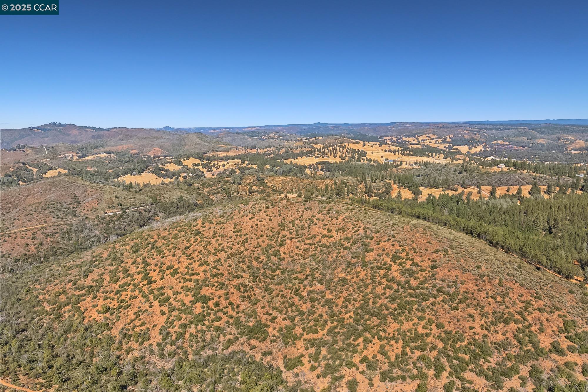 7559 Alamo Rd Mountain Ranch Mountain Ranch, CA 95246 - Photo 6 of 22 an aerial view of residential houses with outdoor space and trees