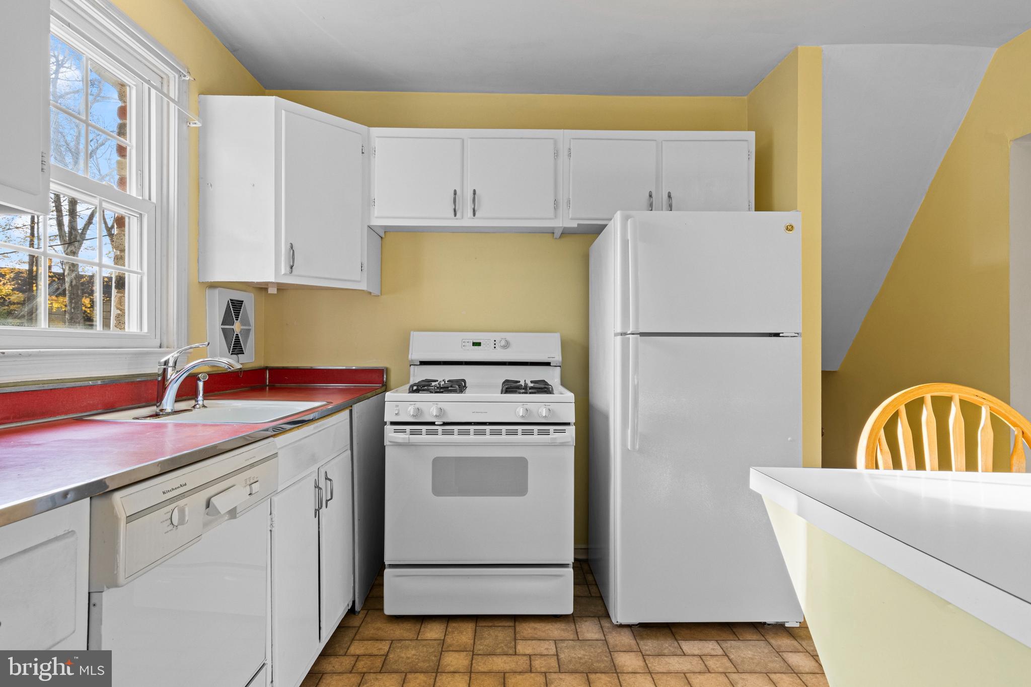320 Landsende Road Devon, PA 19333 - Photo 11 of 26 a kitchen with a sink a stove a refrigerator and a cabinets