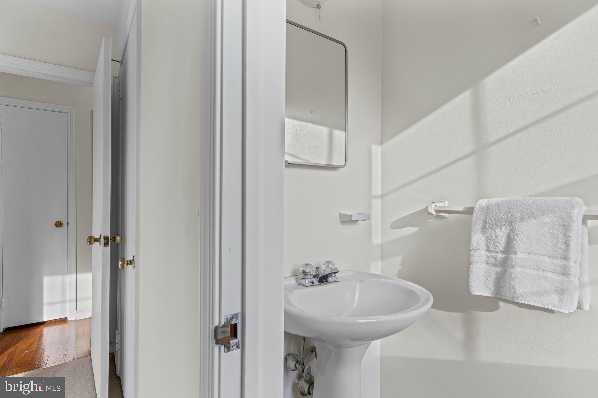 320 Landsende Road Devon, PA 19333 - Photo 17 of 26 a bathroom with a sink mirror and shower