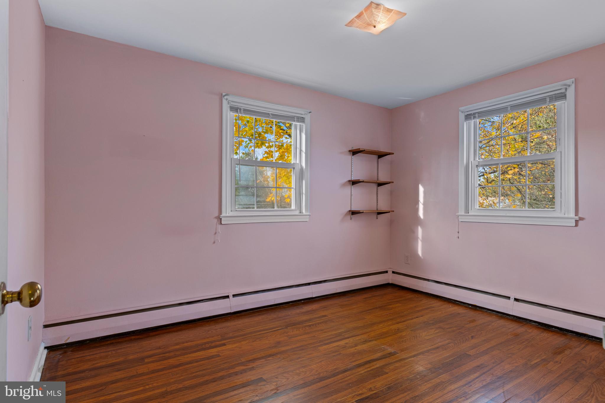 320 Landsende Road Devon, PA 19333 - Photo 19 of 26 a view of empty room with wooden floor and window