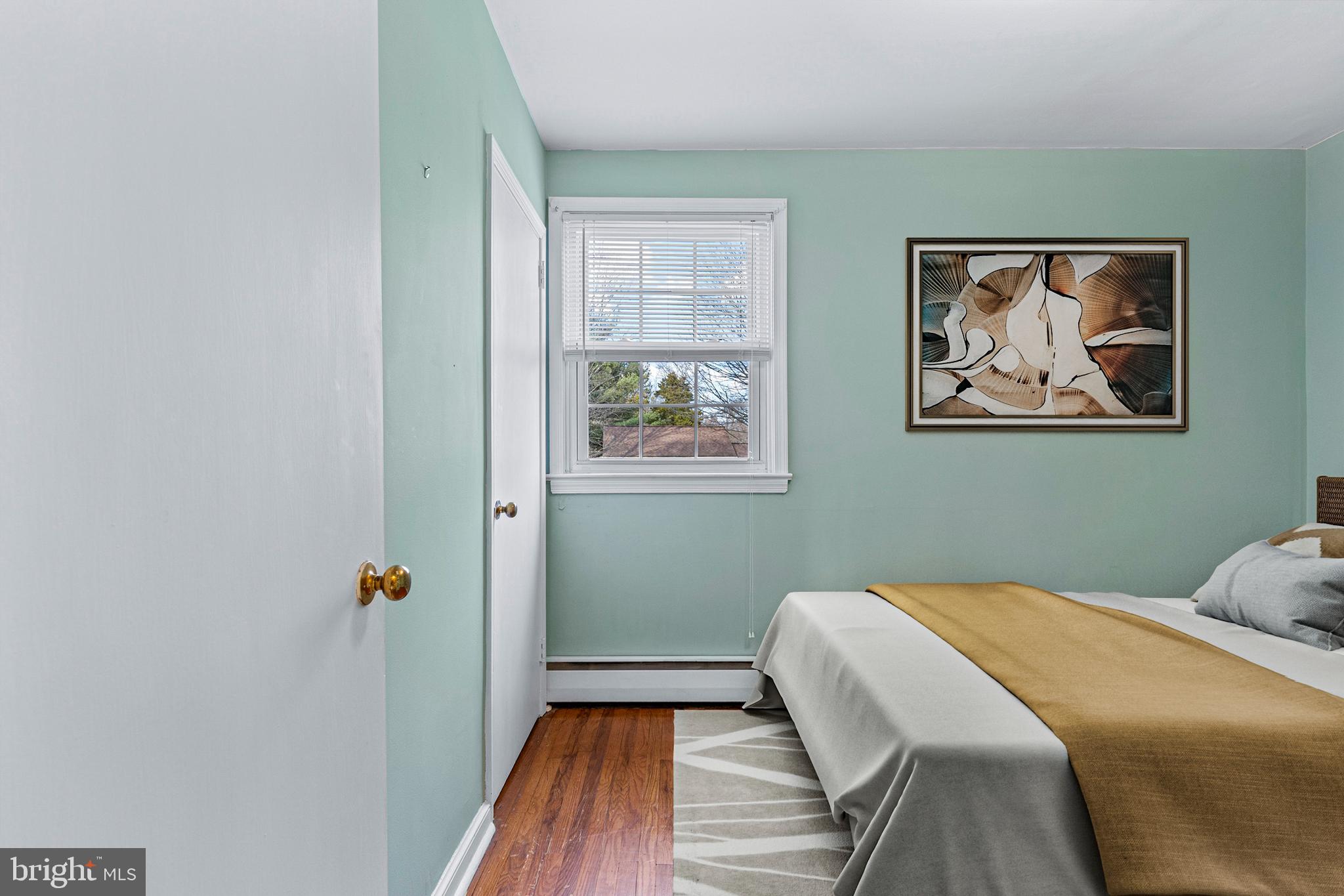 320 Landsende Road Devon, PA 19333 - Photo 21 of 26 a bedroom with a bed and wooden floor