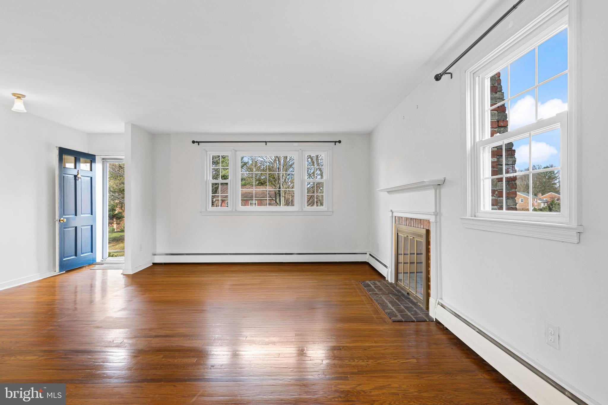 320 Landsende Road Devon, PA 19333 - Photo 5 of 26 a view of an empty room with window and wooden floor