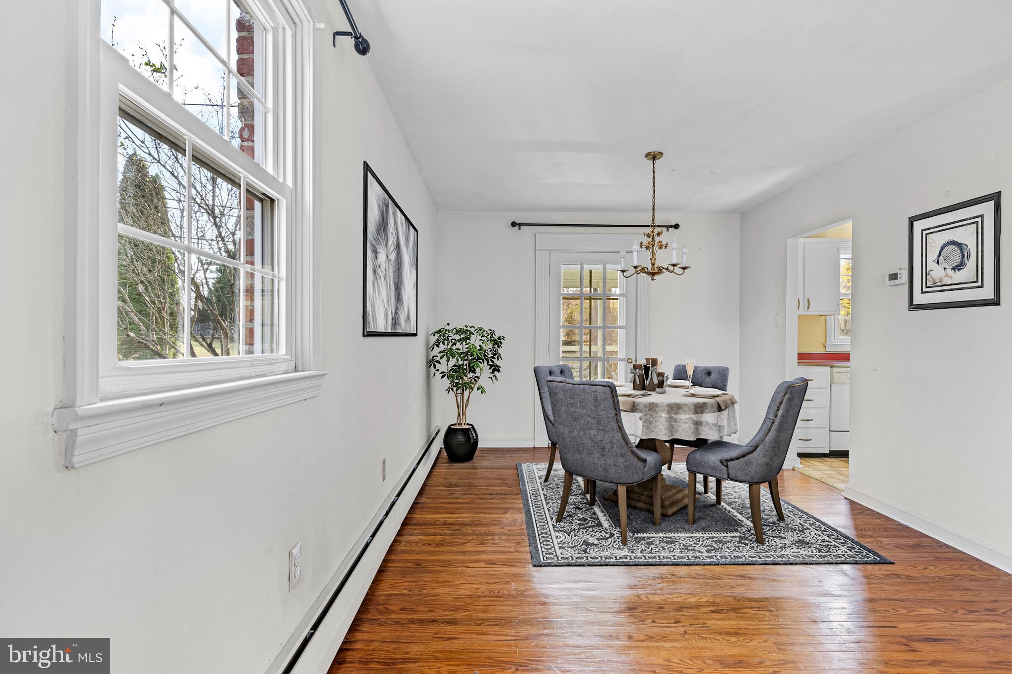 320 Landsende Road Devon, PA 19333 - Photo 7 of 26 a view of a dining room with furniture window and wooden floor