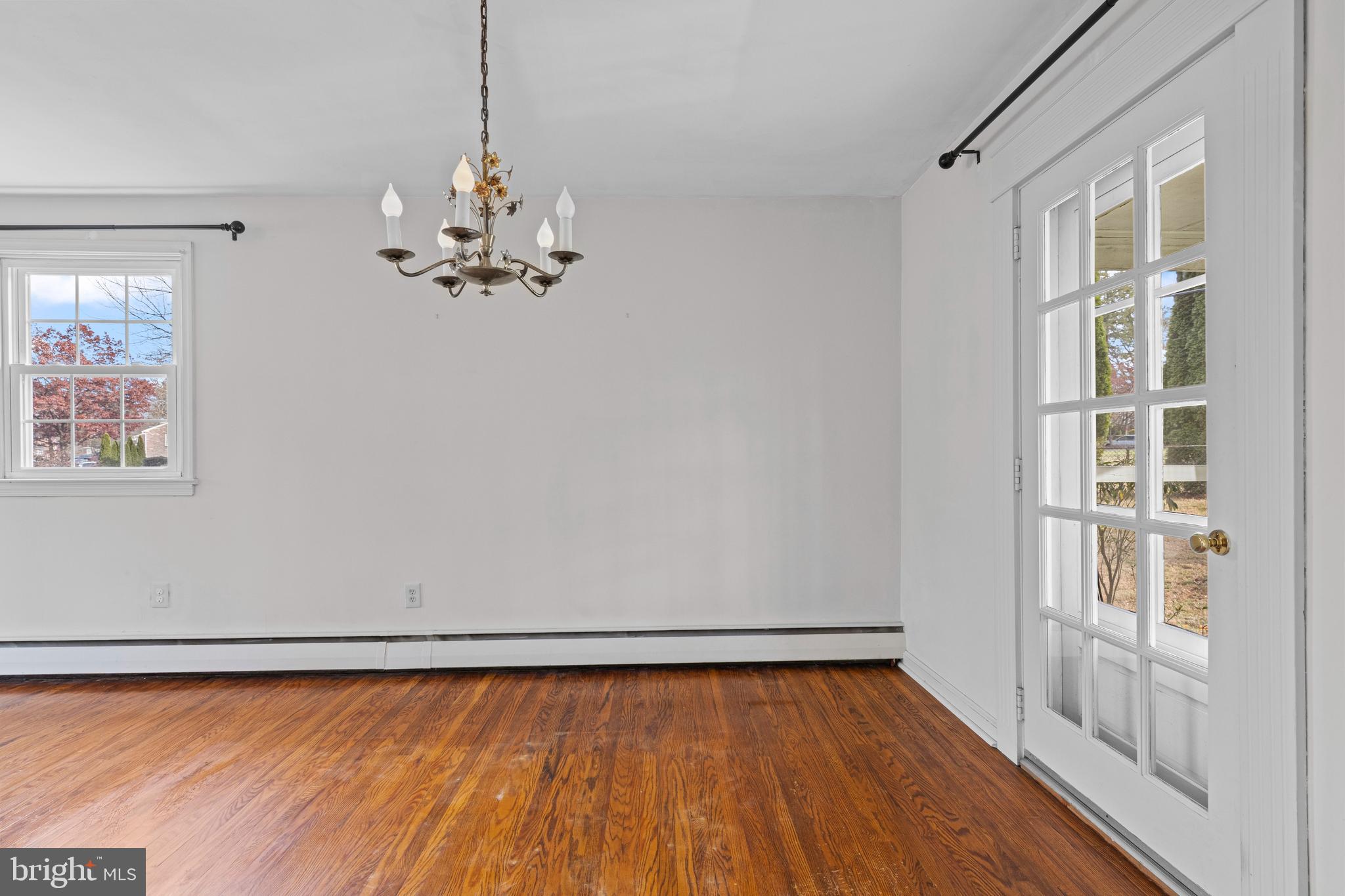 320 Landsende Road Devon, PA 19333 - Photo 9 of 26 a view of a room with wooden floor and a window