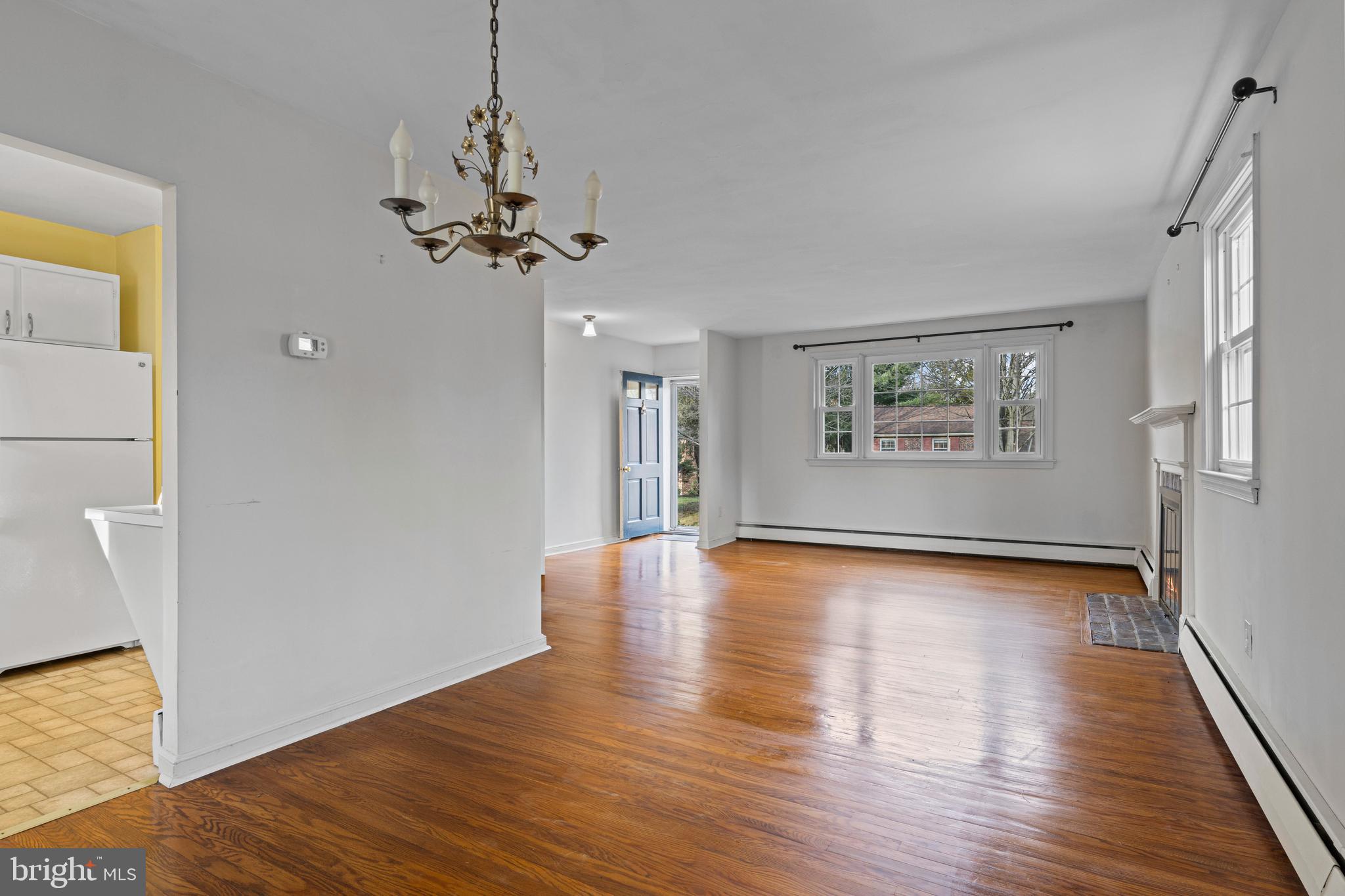 320 Landsende Road Devon, PA 19333 - Photo 10 of 26 a view of an empty room with window and wooden floor