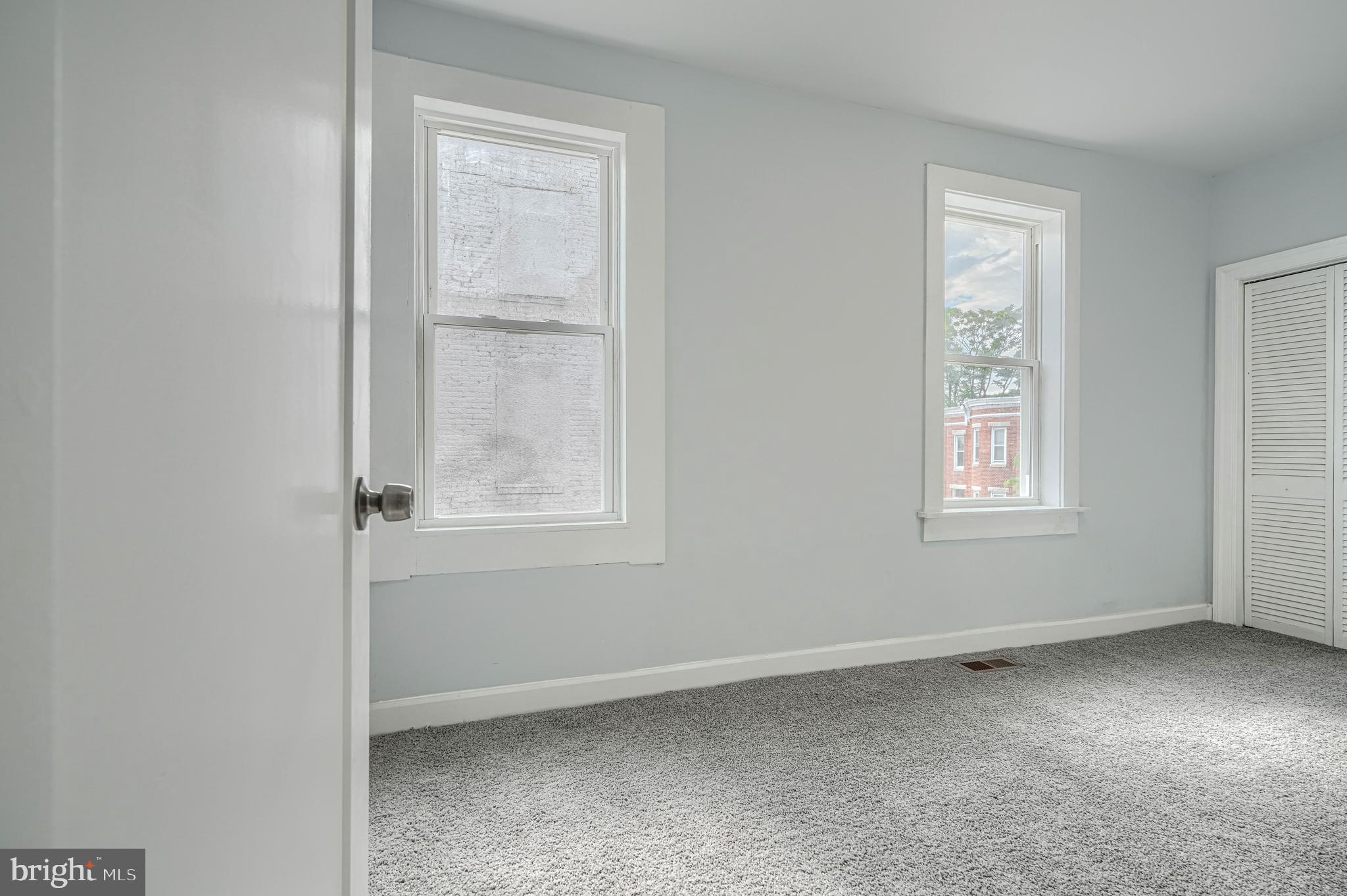 427 East 27th Street Baltimore, MD 21218 - Photo 18 of 24 an empty room with windows and closet