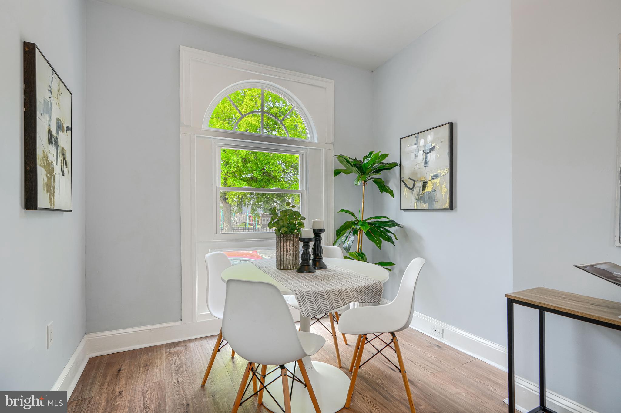 427 East 27th Street Baltimore, MD 21218 - Photo 2 of 24 a dining room with furniture and window