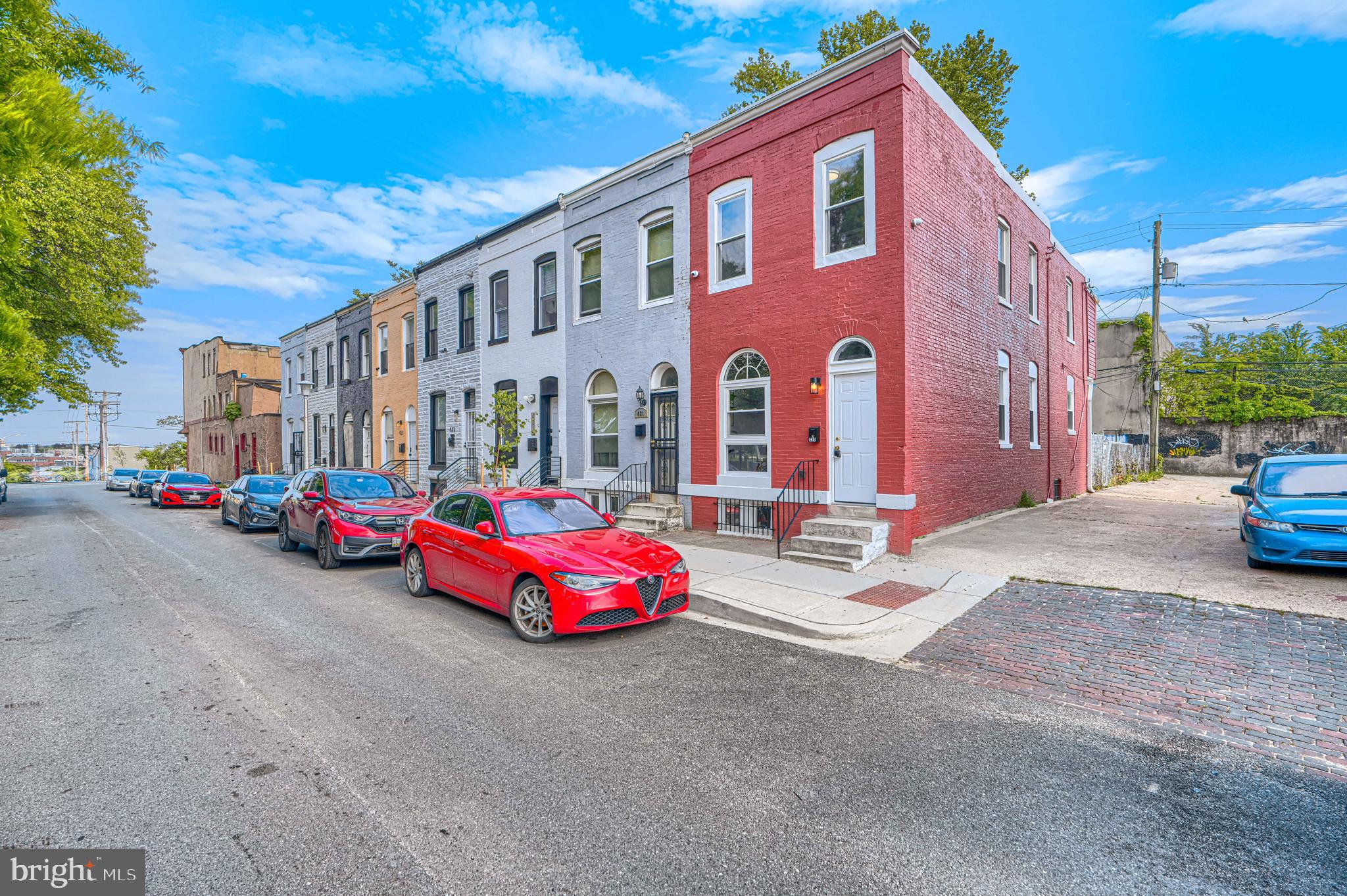 427 East 27th Street Baltimore, MD 21218 - Photo 22 of 24 a view of a street with cars