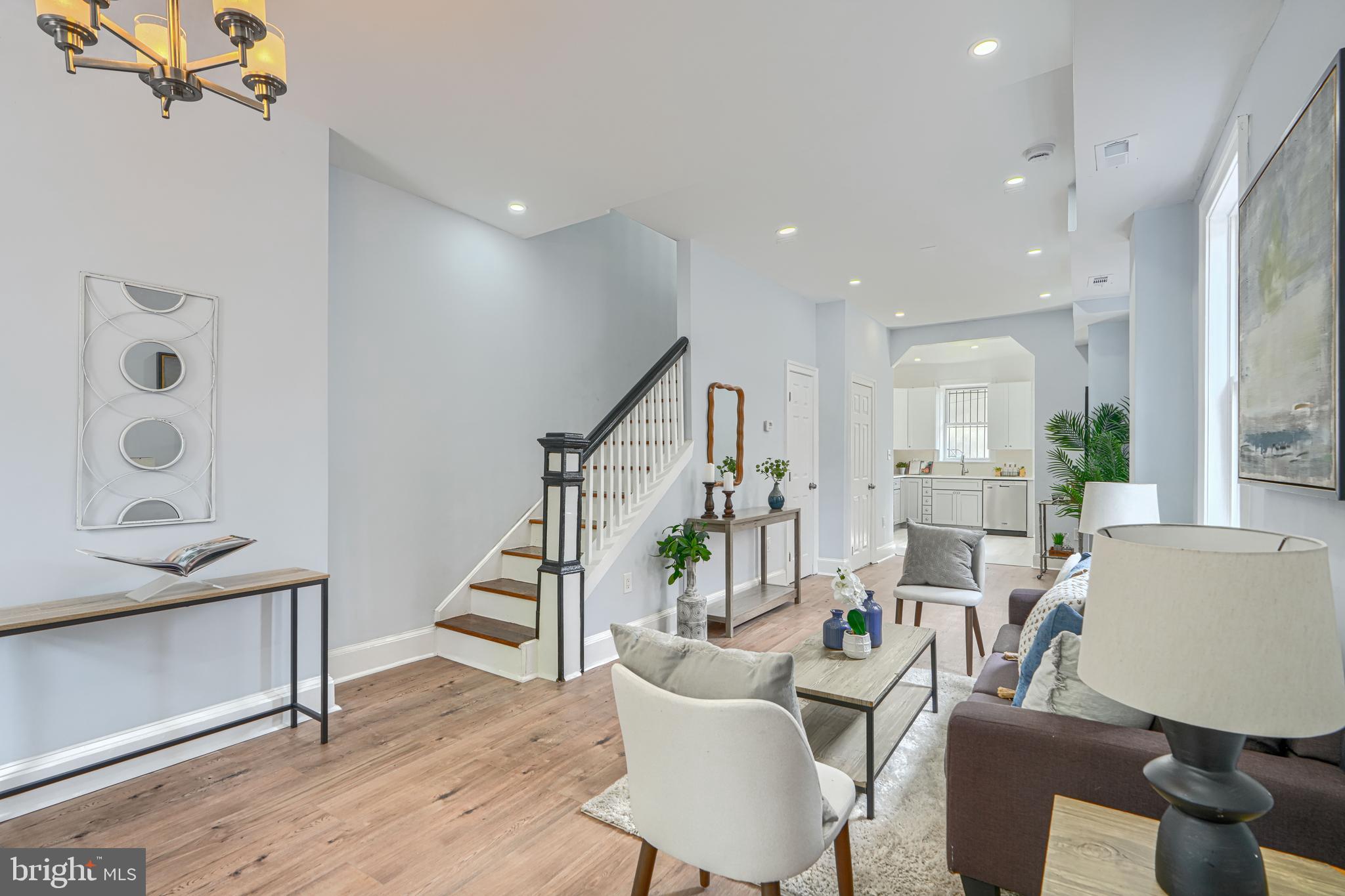 427 East 27th Street Baltimore, MD 21218 - Photo 6 of 24 a living room with furniture and wooden floor