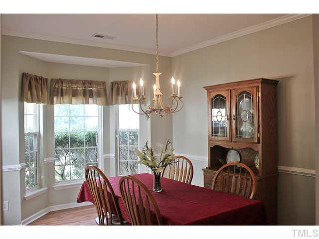 8211 Shadow Stone Court Raleigh, NC 27613 - Photo 3 of 25 Spacious dining room with bay window, and chair rail.