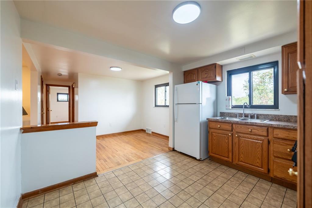 601 Hillcrest Avenue McKees Rocks, PA 15136 - Photo 12 of 32 a kitchen with refrigerator and window