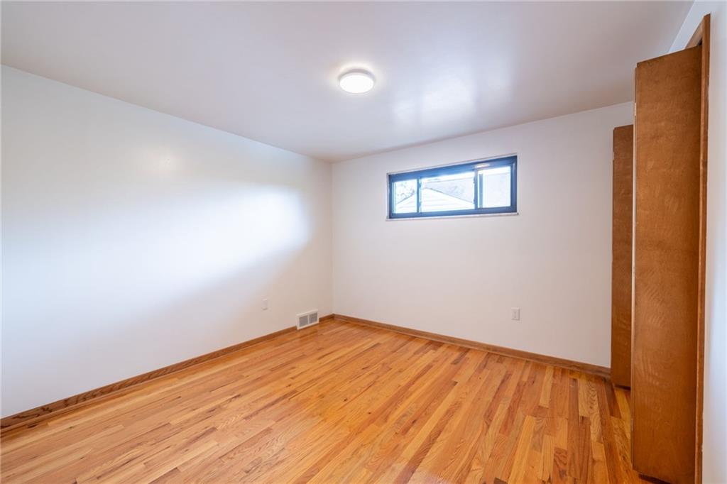 601 Hillcrest Avenue McKees Rocks, PA 15136 - Photo 19 of 32 a view of empty room with wooden floor and fan