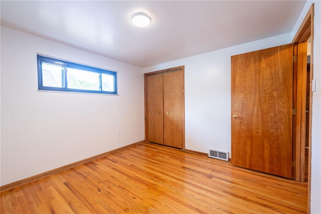 601 Hillcrest Avenue McKees Rocks, PA 15136 - Photo 20 of 32 a view of empty room with wooden floor and fan