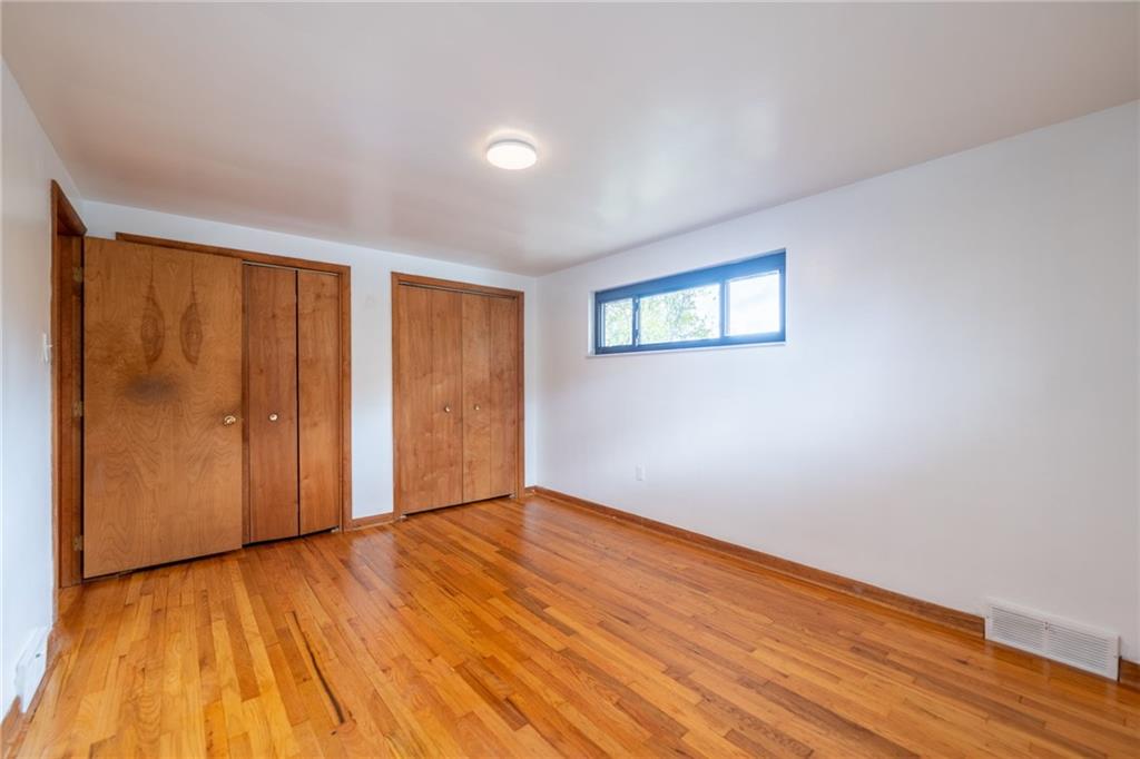 601 Hillcrest Avenue McKees Rocks, PA 15136 - Photo 22 of 32 a view of empty room with wooden floor and fan