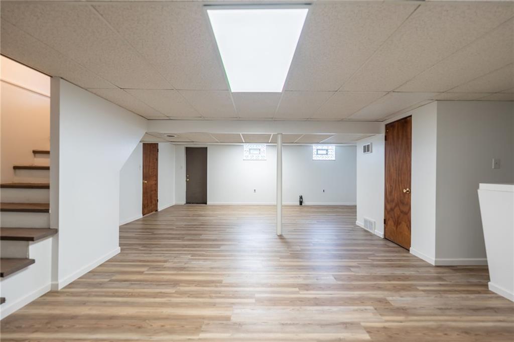 601 Hillcrest Avenue McKees Rocks, PA 15136 - Photo 25 of 32 a view of a hallway with wooden floor and closet