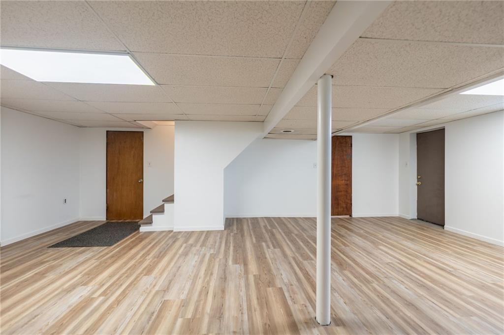 601 Hillcrest Avenue McKees Rocks, PA 15136 - Photo 26 of 32 a view of an empty room with wooden floor